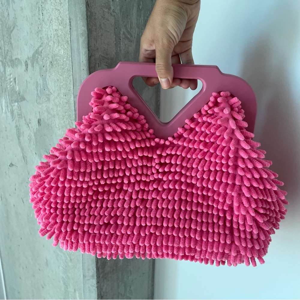 Pink fuzzy purse.